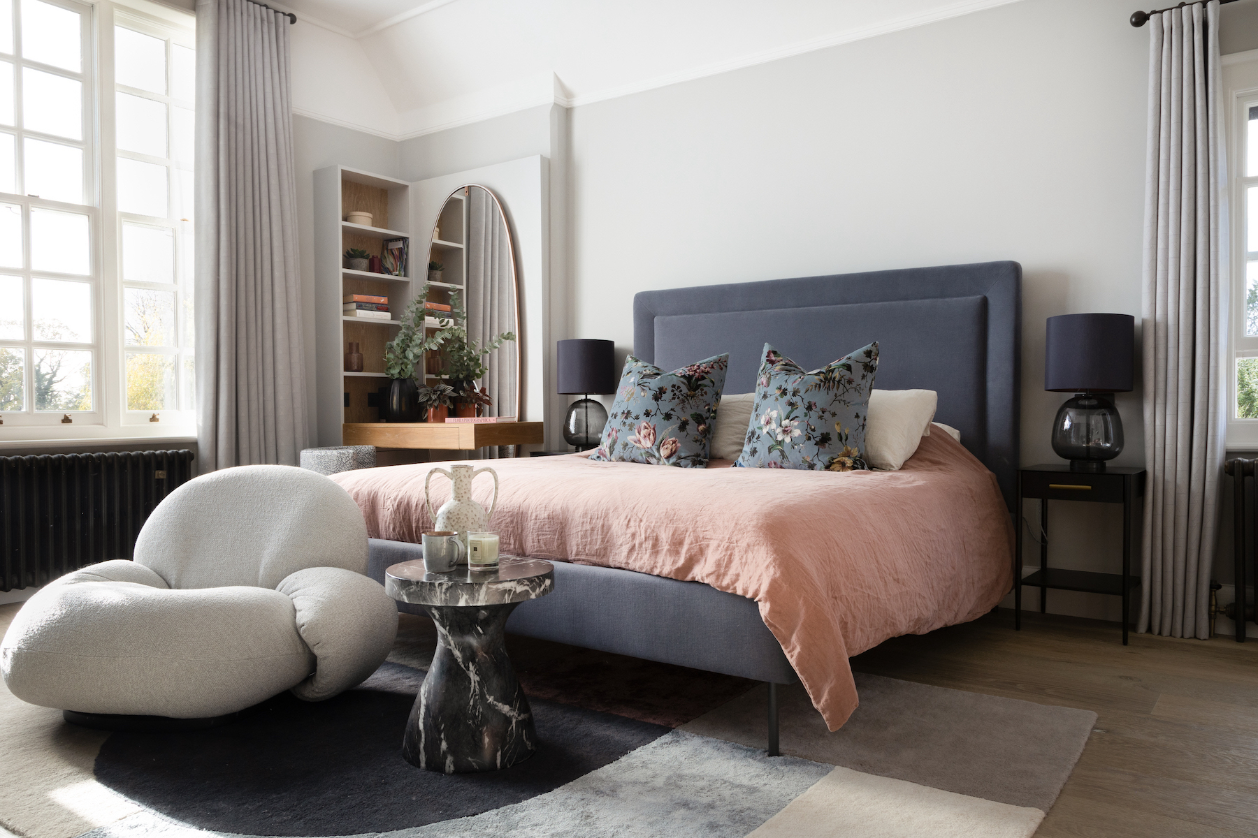 Master Bedroom with Bespoke Upholstery and Joinery Work. Soft calming palette of pinks and neutrals.