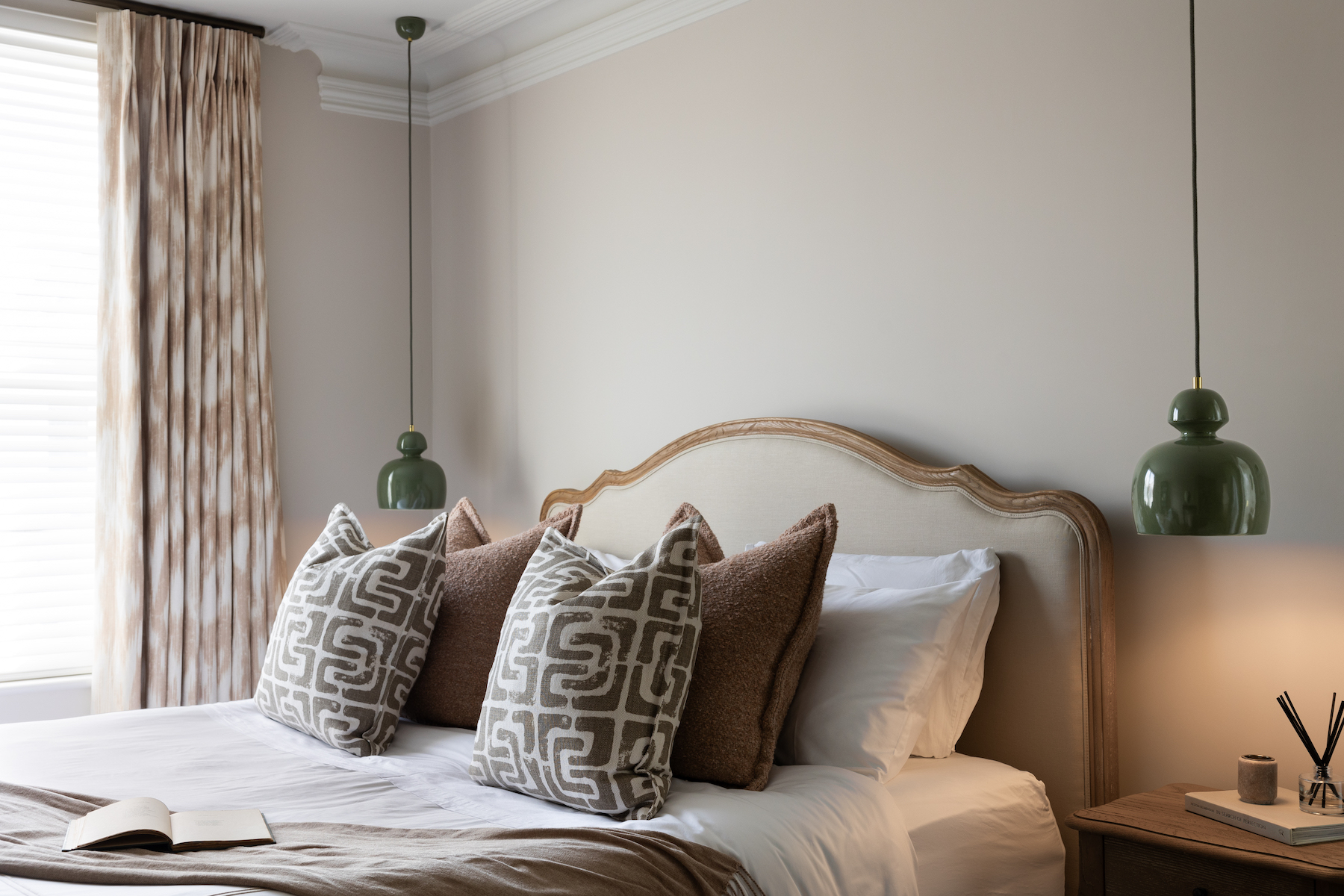 Contemporary Bedroom Designed with Bespoke headboard and Lighting Design by Pfeiffer Design. Neutral colour palette with warmth