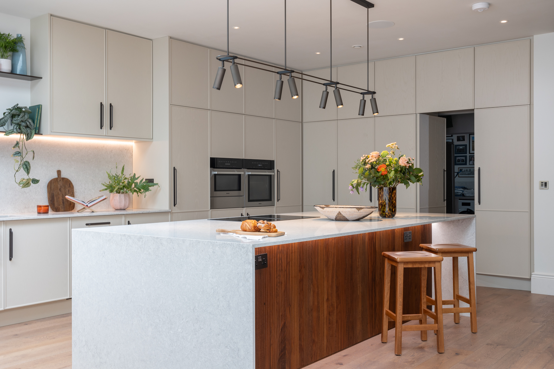 Contemporary Kitchen Designed Bespoke by Pfeiffer Design. Neutral colour palette with warm lighting design